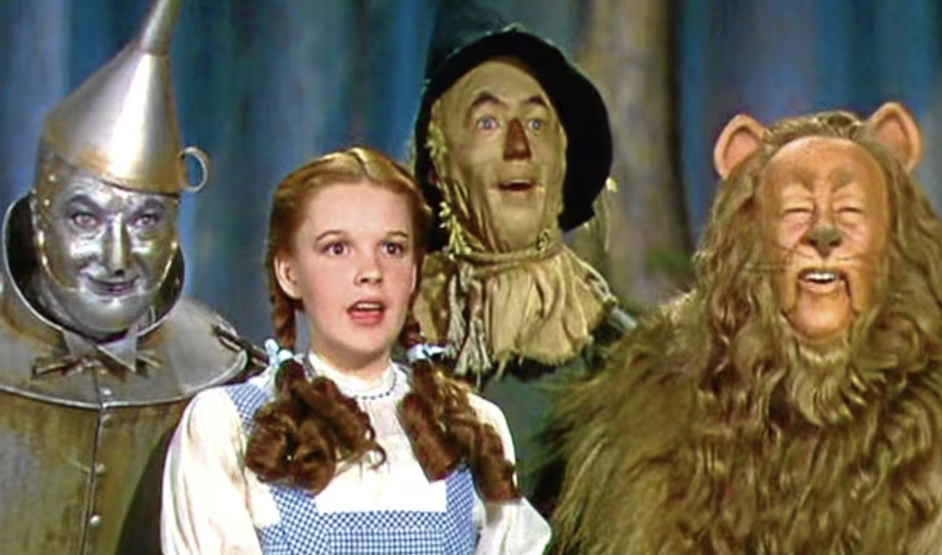 Jack Haley, Judy Garland, Ray Bolger and Bert Lahr as their respective characters in 1939’s The Wizard Of Oz. This was one of the earliest color films in Hollywood history. 